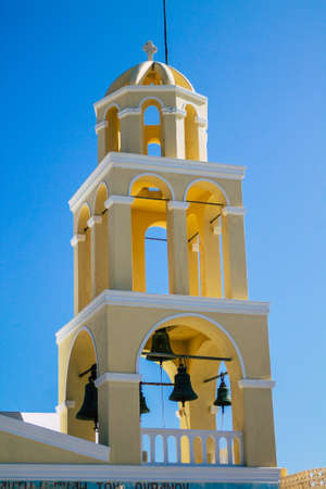 Santorini, Oia, Greece - October 24, 2021 Traditional orthodox church located in the town of Oia front the sea, typical of this island are perched on the side of the ancient active volcanoのeditorial素材