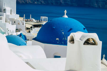 Santorini, Oia, Greece - October 24, 2021 Traditional orthodox church located in the town of Oia front the sea, typical of this island are perched on the side of the ancient active volcanoのeditorial素材