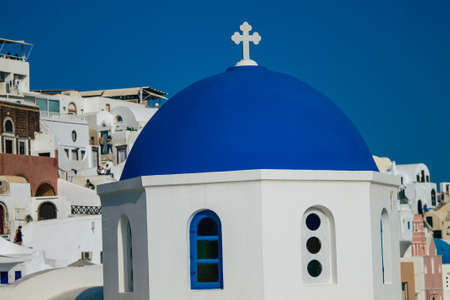 Santorini, Oia, Greece - October 24, 2021 Traditional orthodox church located in the town of Oia front the sea, typical of this island are perched on the side of the ancient active volcanoのeditorial素材