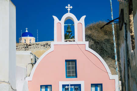 Santorini, Oia, Greece - October 24, 2021 Traditional orthodox church located in the town of Oia front the sea, typical of this island are perched on the side of the ancient active volcanoのeditorial素材