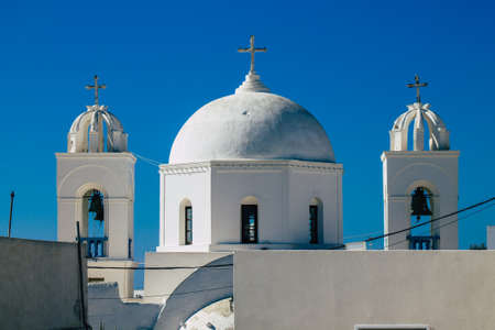 Santorini, Megalochori, Greece - October 24, 2021 Cityscape of Megalochori, the small traditional white houses typical of this island are perched on the side of the ancient active volcanoのeditorial素材