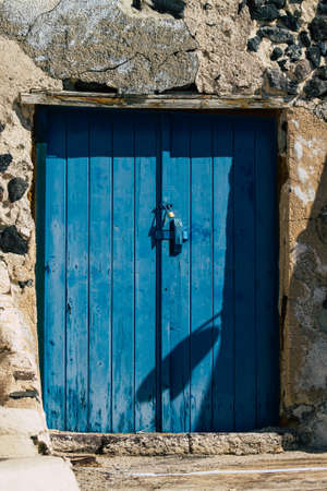 Santorini, Megalochori, Greece - October 24, 2021 Cityscape of Megalochori, the small traditional white houses typical of this island are perched on the side of the ancient active volcanoのeditorial素材