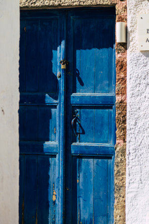 Santorini, Megalochori, Greece - October 24, 2021 Cityscape of Megalochori, the small traditional white houses typical of this island are perched on the side of the ancient active volcanoのeditorial素材