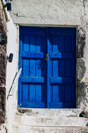 Santorini, Megalochori, Greece - October 24, 2021 Cityscape of Megalochori, the small traditional white houses typical of this island are perched on the side of the ancient active volcanoのeditorial素材