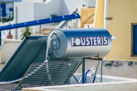 Santorini, Greece - October 28, 2021 Solar water heating on a roof of a building in Santorini, Solar water heating is heating water by sunlight using a solar thermal collectorのeditorial素材