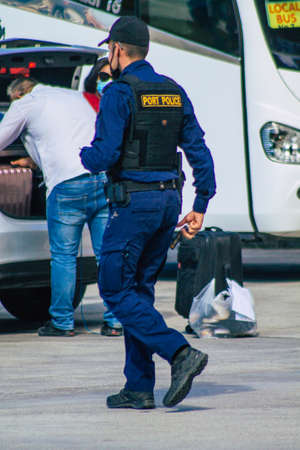 Santorini, Greece - October 28, 2021 Police in the port of Santorini, one of the missions is to control the departure and arrival of ferry passengersのeditorial素材