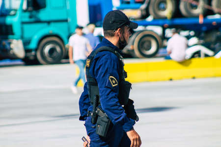 Santorini, Greece - October 28, 2021 Police in the port of Santorini, one of the missions is to control the departure and arrival of ferry passengersのeditorial素材