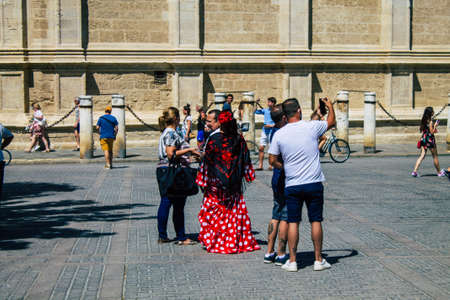 Seville Spain August 11, 2021 Tourists walking in the street of Seville during coronavirus outbreak hitting Spain, wearing a mask in the street is not mandatory but most of people wear itのeditorial素材
