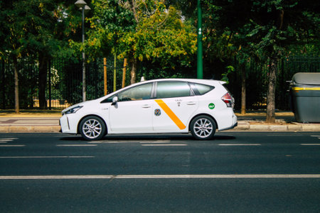 Seville Spain August 11, 2021 Taxi driving through the streets of Seville during the coronavirus...