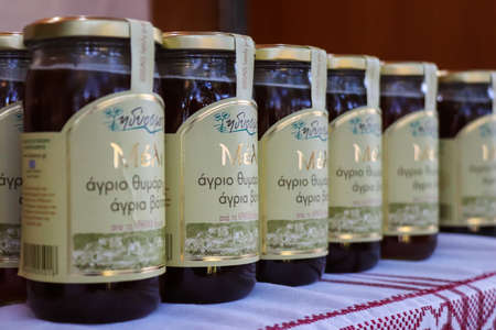 Athens, Greece - November 05, 2021 Honey festival in Athens park, Tasting and sale of jars of various honey produced in Greece and Crete, bee growers explain to visitors how honey is madeの写真素材