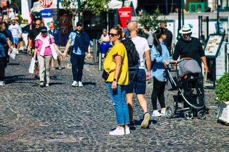 Santorini, Fira, Greece - October 20, 2021 Crowd of tourists at the bus station, all the buses depart and finish their routes, 6 destinations including the airport, north and south ends of the islandのeditorial素材