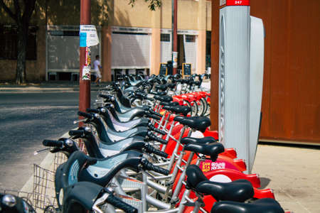 Seville Spain August 11, 2021 Accessible bicycles to hire for short periods of time, usually for a few hours parked in the street and part of the public transport system of Sevilleのeditorial素材