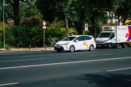 Seville Spain August 11, 2021 Taxi driving through the streets of Seville during the coronavirus...