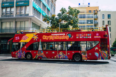 Seville Spain August 11, 2021 Tourist bus driving through the streets of Seville during the...