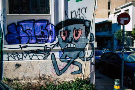 Athens, Greece - November 22, 2021 Street art in Athens, graffiti that covers the whole city, where every alley, shop front, brick wallis an artistic canvas, of political reference or of social satireの写真素材