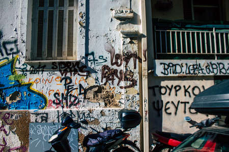 Athens, Greece - November 22, 2021 Street art in Athens, graffiti that covers the whole city, where every alley, shop front, brick wallis an artistic canvas, of political reference or of social satireの写真素材