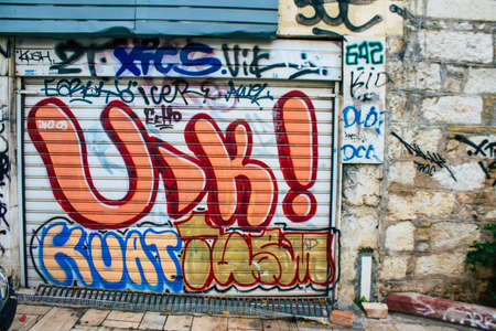 Athens, Greece - November 22, 2021 Street art in Athens, graffiti that covers the whole city, where every alley, shop front, brick wallis an artistic canvas, of political reference or of social satireの写真素材