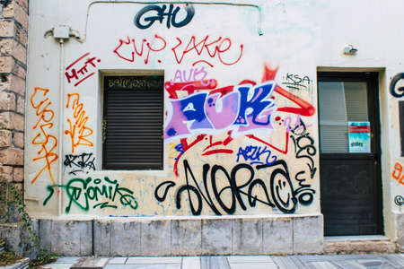 Athens, Greece - November 22, 2021 Street art in Athens, graffiti that covers the whole city, where...