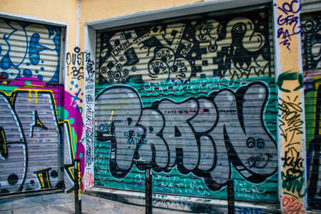 Athens, Greece - November 22, 2021 Street art in Athens, graffiti that covers the whole city, where every alley, shop front, brick wallis an artistic canvas, of political reference or of social satireの写真素材