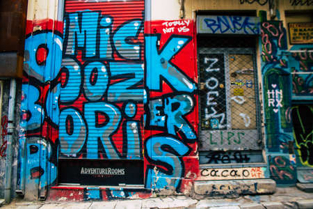 Athens, Greece - November 22, 2021 Street art in Athens, graffiti that covers the whole city, where every alley, shop front, brick wallis an artistic canvas, of political reference or of social satireの写真素材