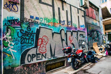 Athens, Greece - November 22, 2021 Street art in Athens, graffiti that covers the whole city, where every alley, shop front, brick wallis an artistic canvas, of political reference or of social satireの写真素材
