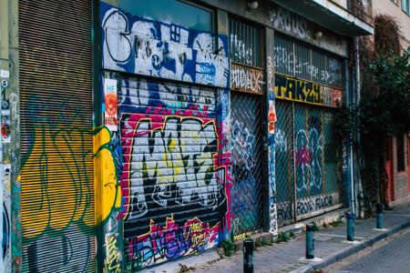 Athens, Greece - November 22, 2021 Street art in Athens, graffiti that covers the whole city, where...