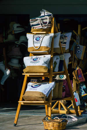Santorini Island, Fira, Greece - October 23, 2021 Decorative objects, accessories and goods sold to tourists in souvenir shops of Fira, tourist town and capital of Santorini in the Greek Islandsのeditorial素材