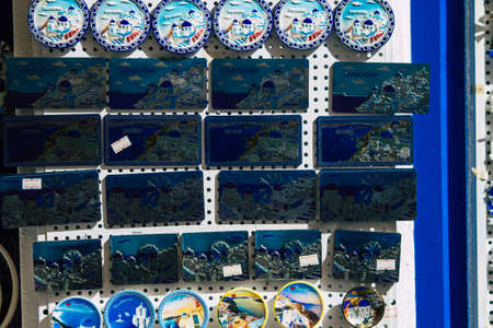 Santorini Island, Fira, Greece - October 23, 2021 Decorative objects, accessories and goods sold to tourists in souvenir shops of Fira, tourist town and capital of Santorini in the Greek Islandsのeditorial素材