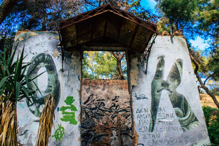 Athens, Greece - November 20, 2021 StrÃ©fi Hill is an urban nature park covered in tags and messages made by anarchist artists, located in the district of Exarcheia, considered the rebel area of Athensのeditorial素材