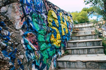 Athens, Greece - November 20, 2021 StrÃ©fi Hill is an urban nature park covered in tags and messages made by anarchist artists, located in the district of Exarcheia, considered the rebel area of Athensのeditorial素材