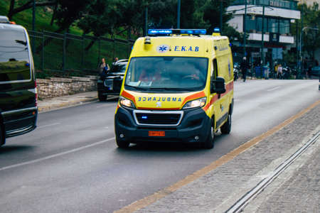 Athens, Greece - November 20, 2021 Greek ambulance driving through the streets of Athens during the...