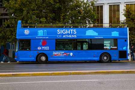 Athens, Greece - November 22, 2021 Tourist bus driving through the streets of Athens during the...