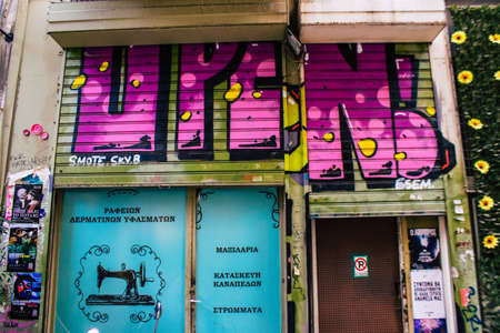 Athens, Greece - November 22, 2021 Street art in Athens, graffiti that covers the whole city, where every alley, shop front, brick wallis an artistic canvas, of political reference or of social satireのeditorial素材