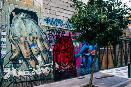 Athens, Greece - November 22, 2021 Street art in Athens, graffiti that covers the whole city, where every alley, shop front, brick wallis an artistic canvas, of political reference or of social satireのeditorial素材