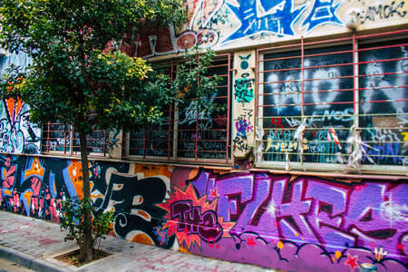 Athens, Greece - November 22, 2021 Street art in Athens, graffiti that covers the whole city, where every alley, shop front, brick wallis an artistic canvas, of political reference or of social satireのeditorial素材