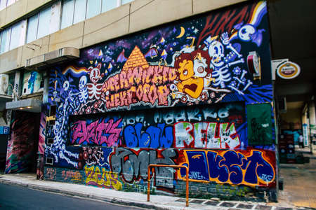 Athens, Greece - November 22, 2021 Street art in Athens, graffiti that covers the whole city, where every alley, shop front, brick wallis an artistic canvas, of political reference or of social satireのeditorial素材