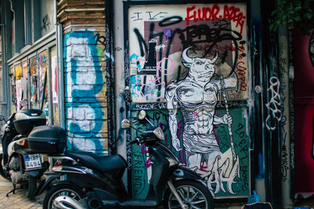 Athens, Greece - November 22, 2021 Street art in Athens, graffiti that covers the whole city, where every alley, shop front, brick wallis an artistic canvas, of political reference or of social satireのeditorial素材