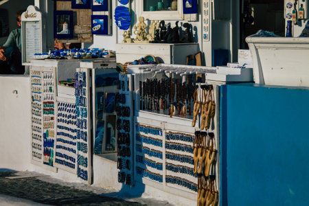 Santorini Island, Fira, Greece - October 23, 2021 Decorative objects, accessories and goods sold to tourists in souvenir shops of Fira, tourist town and capital of Santorini in the Greek Islandsのeditorial素材