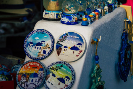 Santorini Island, Fira, Greece - October 23, 2021 Decorative objects, accessories and goods sold to tourists in souvenir shops of Fira, tourist town and capital of Santorini in the Greek Islandsのeditorial素材