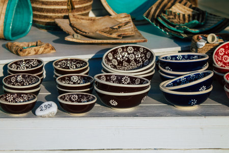 Santorini Island, Fira, Greece - October 23, 2021 Decorative objects, accessories and goods sold to tourists in souvenir shops of Fira, tourist town and capital of Santorini in the Greek Islandsのeditorial素材