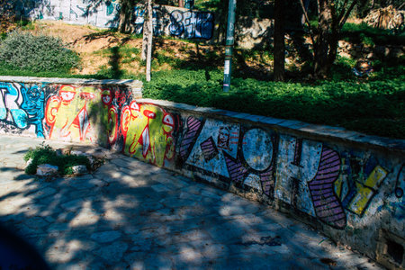 Athens, Greece - November 20, 2021 StrÃ©fi Hill is an urban nature park covered in tags and messages made by anarchist artists, located in the district of Exarcheia, considered the rebel area of Athensのeditorial素材