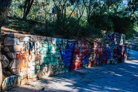Athens, Greece - November 20, 2021 StrÃ©fi Hill is an urban nature park covered in tags and messages made by anarchist artists, located in the district of Exarcheia, considered the rebel area of Athensのeditorial素材