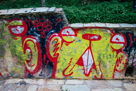 Athens, Greece - November 20, 2021 StrÃ©fi Hill is an urban nature park covered in tags and messages made by anarchist artists, located in the district of Exarcheia, considered the rebel area of Athensのeditorial素材