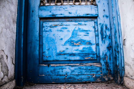 Limassol, Cyprus - December 03, 2021 Detailed close-up of an old door totally damaged by the weather of an old house in the old district of Limassol in Cyprusの写真素材