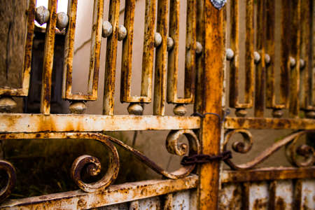 Limassol, Cyprus - December 03, 2021 Detailed close-up of an old door totally damaged by the weather...