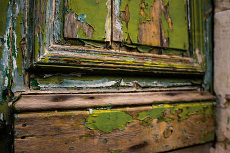 Limassol, Cyprus - December 03, 2021 Detailed close-up of an old door totally damaged by the weather...