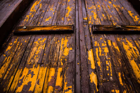 Limassol, Cyprus - December 03, 2021 Detailed close-up of an old door totally damaged by the weather of an old house in the old district of Limassol in Cyprusの写真素材