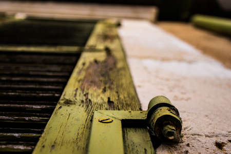 Limassol, Cyprus - December 03, 2021 Detailed close-up of an old window totally damaged by the weather of an old house in the old district of Limassol in Cyprusの写真素材
