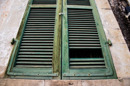 Limassol, Cyprus - December 03, 2021 Detailed close-up of an old window totally damaged by the...