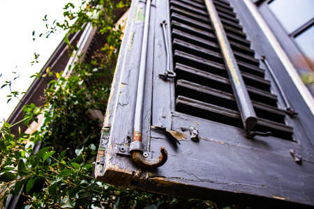 Limassol, Cyprus - December 03, 2021 Detailed close-up of an old window totally damaged by the...